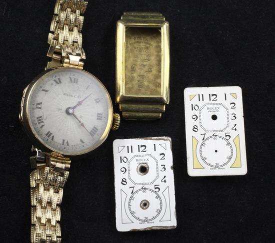 A ladys 1920s 9ct gold Rolco manual wind wrist watch, an 18ct gold Rolex watch case and two Rolex Prince watch dials.